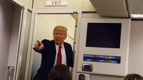 Obama did it: US President Donald Trump speaks to reporters aboard Air Force One before landing in Maryland on Wednesday.