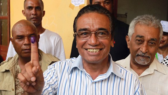 Fretilin leader Francisco "Lu-Olo" Guterres, centre, is seen with former prime minister Mari Alkatiri, right, after voting.