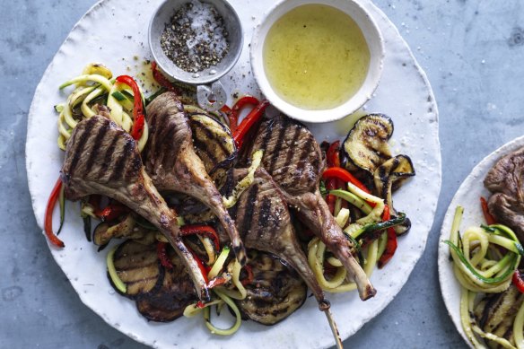 Barbecued lamb cutlets with salad and mint jelly. 