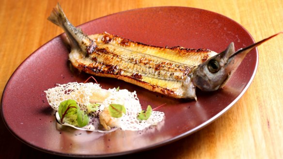 A butterflied garfish entree is dramatically presented.