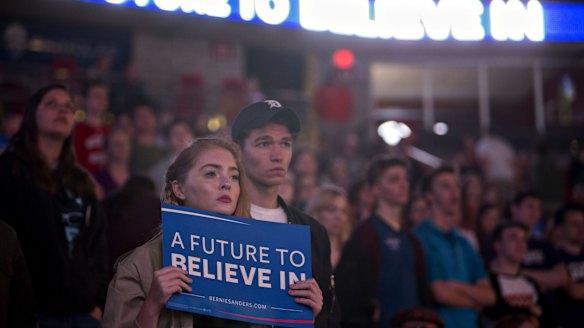 Supporters listen to Senator Bernie Sanders at a campaign event in Madison, Wisconsin on Sunday. 