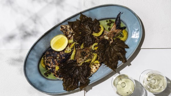 Butterflied whole snapper with fried vine leaves at Topikos, Bondi Beach.