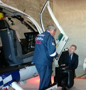 Police Minister Jack Dempsey inspects Polair 2 with Westpac Lifesaver Helicopter Rescue Service chief Pilot Peter Bird.