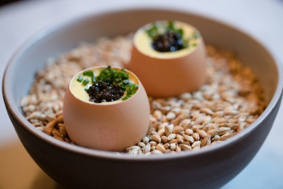 Snacks might include a soft-boiled egg with cream corn and caviar.