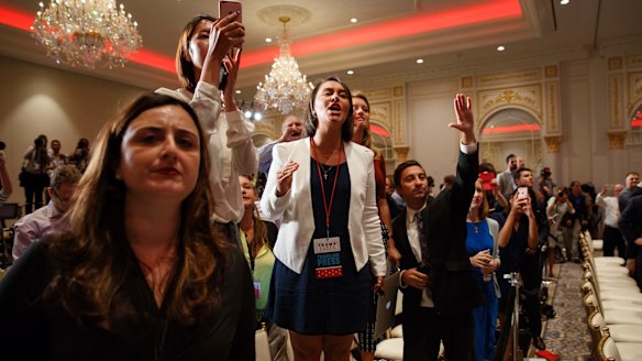 Reporters shout questions at Donald Trump during the 'Birther' conference at Trump International Hotel. They were promised it would be a media conference, but Trump did not answer questions.