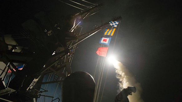 The USS Ross fires a Tomahawk missile at Syria from the Mediterranean Sea. 