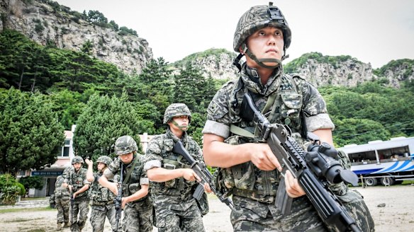 South Korean Marines patrol along the coast of the eastern island of Ulleung, South Korea, on Saturday as part of the largest-ever training to defend the island.