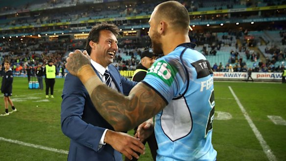 Relieved: Blues coach Laurie Daley congratulates Blake Ferguson.