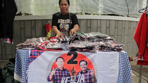 An Ahok shirt seller waits for customers in the Jakarta suburb of Menteng.  