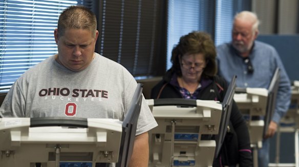 Early voters cast their ballots on electronic voting machines  in Lancaster, Ohio, on Saturday.