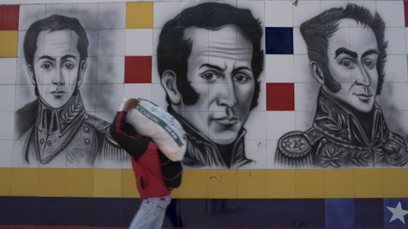 A pedestrian walks across the Simon Bolivar Bridge from Colombia into Venezuela The border has been shut and reopened in response to economic woes.