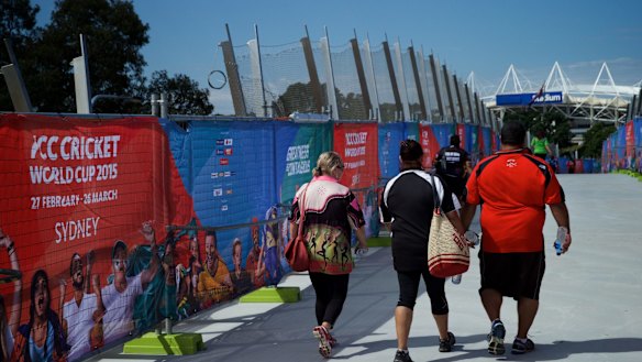Pedestrians using the Albert Tibby Cotter Bridge over Anzac Parade during the world cup.