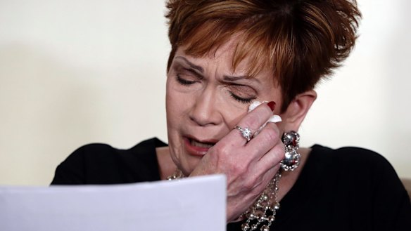 Beverly Young Nelson, the latest accuser of Alabama Republican Roy Moore, reads her statement at a news conference on Monday.