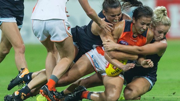 Rebecca Beeson of the Giants is tackled during the GWS Giants and Carlton game at Drummoyne Oval.