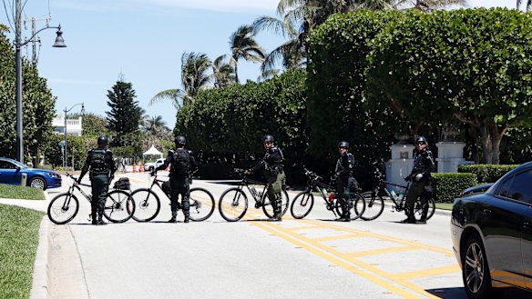 Sheriff's deputies block the street as Donald Trump and Xi Jinping meet at Mar-a-Lago.