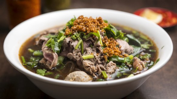 Thai noodle soup with sliced beef.