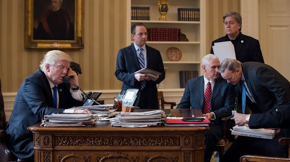 President Trump speaks on the phone with Russian President Putin in the Oval Office on January 28.
