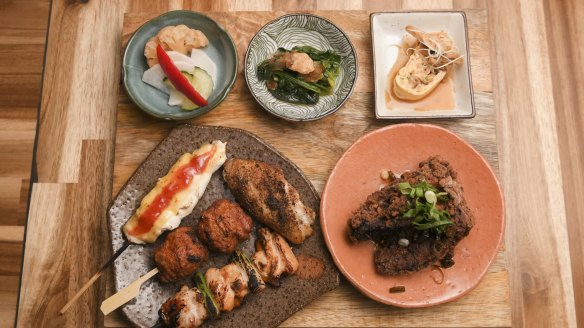 Tori set with miso, yakitori, fried chicken and little plates of pickles.