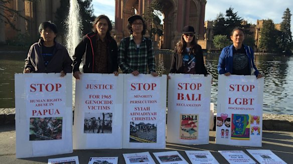 Protesters outside the Palace of Fine ArtsTheatre in San Francisco on Tuesday called on President Joko Widodo to address human rights.