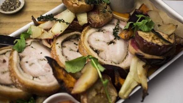 Go-to dish: Slow-roasted porchetta with vegetables, spiced half apple and quince sauce.