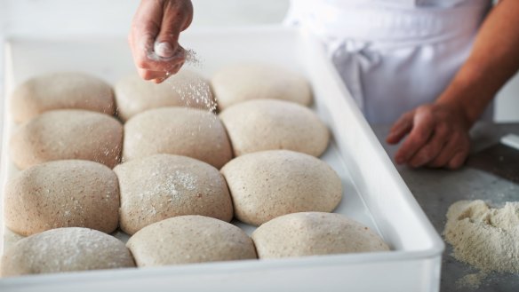 Flour power: Shaping the pizza balls, from the book 