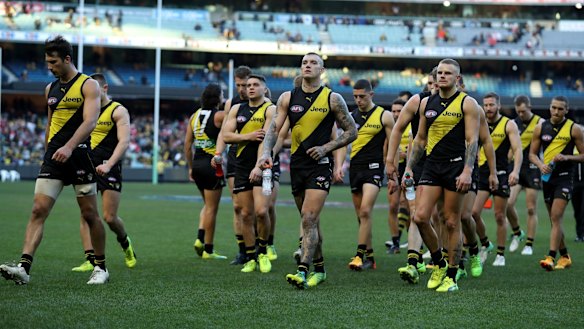 The devastated Tigers leave the field after the loss.