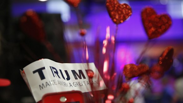 A Donald Trump supporter holds a "Trump" sign before Republican presidential candidate Donald Trump speaks in Mississippi on Monday.