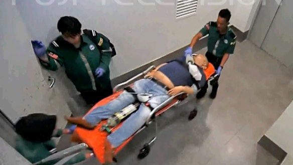 Kim Jong-nam, half-brother of North Korean leader Kim Jong-un, is taken into a lift at Kuala Lumpur International Airport, Malaysia, on February 13.