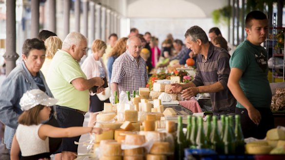 The whole town has a carnival feel as people wander and shop and stop for food and drink, and laugh and chat on the street.