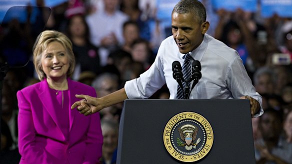 I'm with her: President Barack Obama and Hillary Clinton on Tuesday.