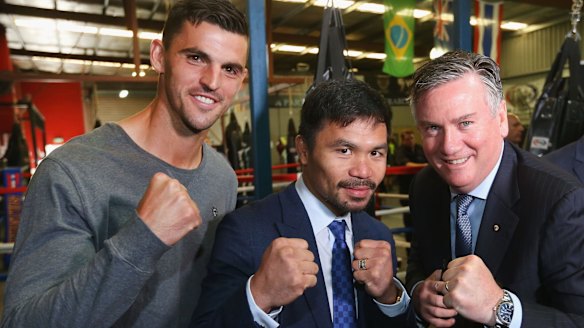 Big hit: Manny Pacquiao poses with Scott Pendlebury and Collingwood President Eddie Maguire during a press conference at Invictus Gym in Melbourne.