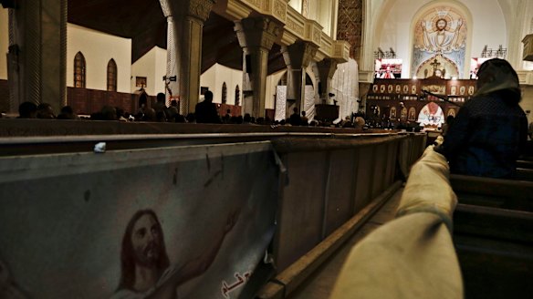 Egyptian Coptic Christians prepare to pray during the Easter Eve service at St Mark's Cathedral in Cairo, Egypt after an attack on the church on Palm Sunday.