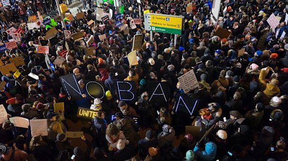 Protesters assemble at John F. Kennedy International Airport in New York after  two Iraqi refugees were detained while trying to enter the country. 