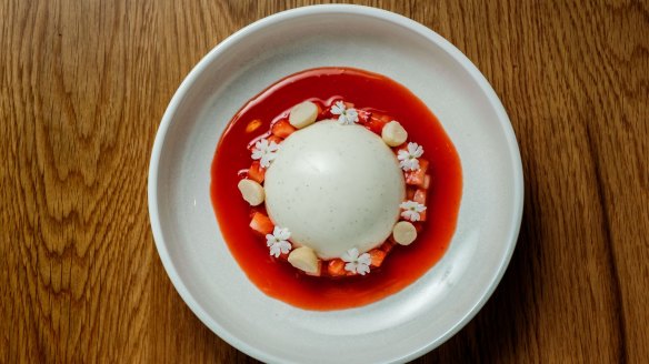 Yoghurt and vanilla panna cotta, ringed by fresh berries, macadamia and elderflower blossoms.