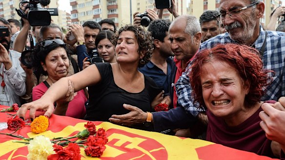 Family members of Korkmaz Tedik, a victim of the October 10 attack, mourn in Ankara.