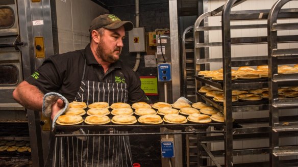 Head baker of Apollo Bay Bakery, James Crump, with the first batch of Victorian scallop pies.