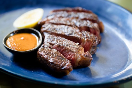 300g grass-fed Brooklyn Valley rib eye with grilled lemon and black garlic barbecue sauce.