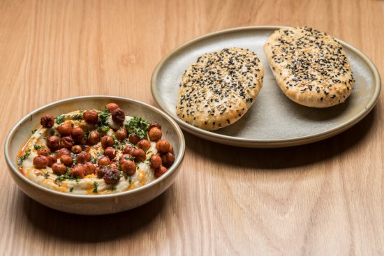 Fava bean hummus with crisp chickpeas and flatbreads.