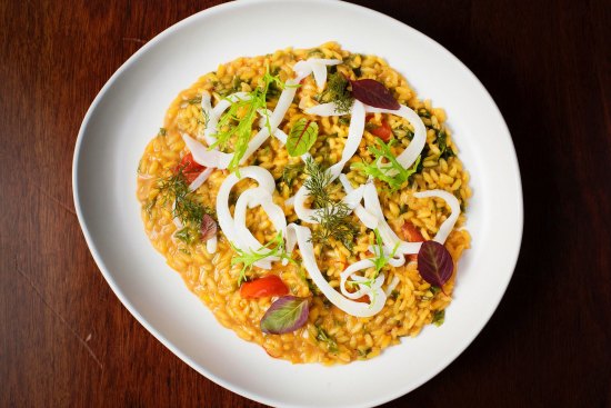 Saffron risotto, cuttlefish, cherry tomato and sea vegetables.