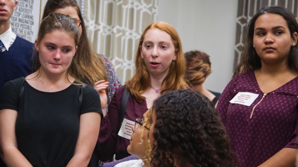 Lizzie Eaton, center, a 16-year-old survivor from Marjory Stoneman Douglas High School, directs a question to Senator Bobby Powell in his office at the Florida Capital in Tallahassee.