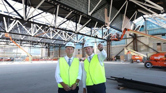 Premier Mike Baird and Infrastructure Minister Andrew Constance inspect the new roof.