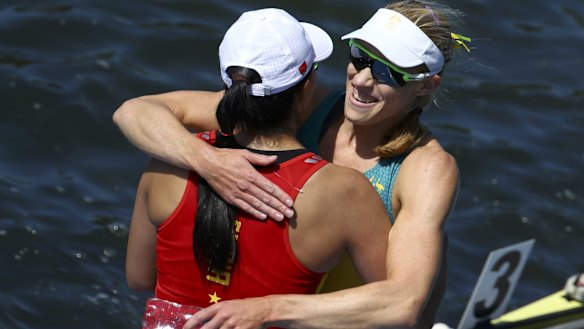 Australian gold medalist Kim Brennan and Bronze medalist Duan Jingli of China embrace after their final at Rio's Lagoa Stadium on Saturday.