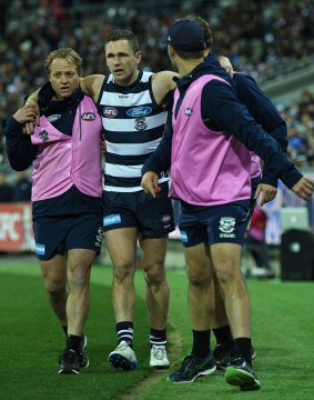Joel Selwood helped off the field after injuring himself on August 4.