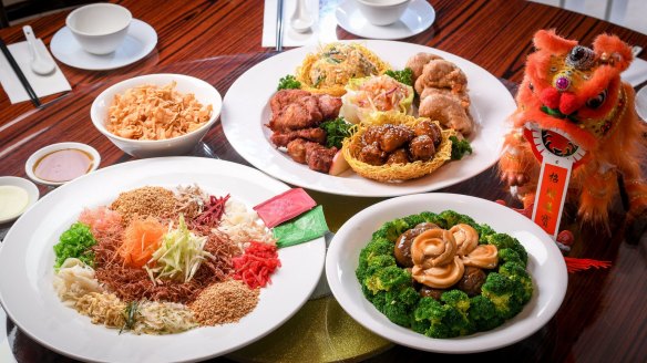 Jonker Street's prosperity salmon salad, 'platter of blessed happiness' (pork ribs, vegetarian balls, yam and prawns) and abalone with mushrooms.