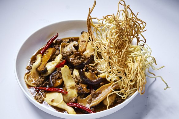 Sichuan braised mushrooms with crispy lamb and egg noodles. 