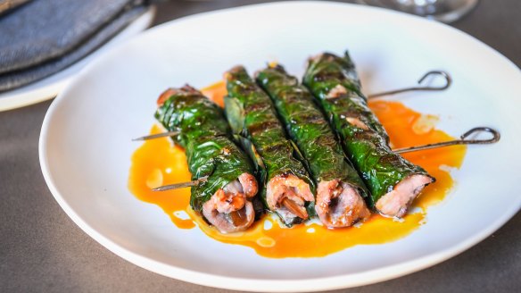 Pork scotch fillet with prune wrapped in betel leaves.