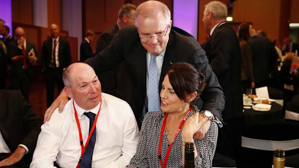 Treasurer Scott Morrison with his brother-in-law Gary Warren and his wife Michelle Warren.