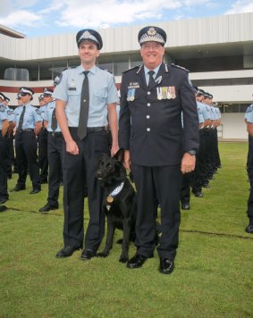 Police Dog Bravo and his handler, Sergeant Constable Joseph Alofipo are welcomed by Queensland Police Service Commissioner Ian Stewart.
