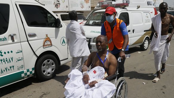A rescue worker attends to a man injured in the stampede in Mina, Saudi Arabia.