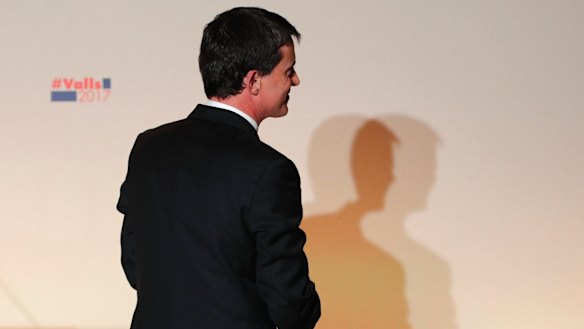 Former socialist Prime Minister Manuel Valls leaves after delivering a speech following his defeat at the French presidential primaries.